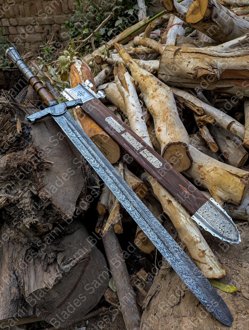 Angled view of a handcrafted Damascus steel Knight Templar Sword with scabbard highlighting detailed craftsmanship