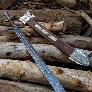 Angled view of a handcrafted Damascus steel Knight Templar Sword with scabbard highlighting detailed craftsmanship