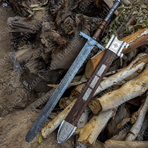 Angled view of a handcrafted Damascus steel Knight Templar Sword with scabbard highlighting detailed craftsmanship