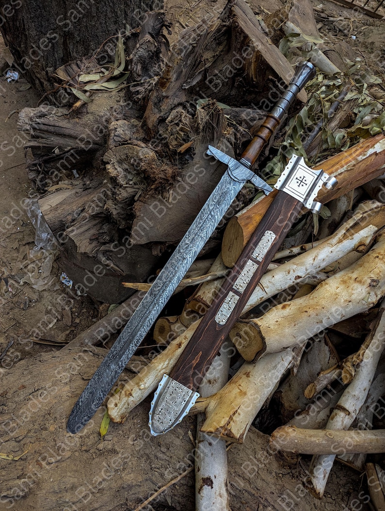 Angled view of a handcrafted Damascus steel Knight Templar Sword with scabbard highlighting detailed craftsmanship