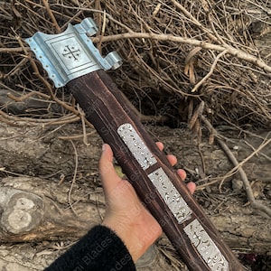 Decorative wooden scabbard with Damascus inlays and steel accents designed for a medieval sword and Viking style display