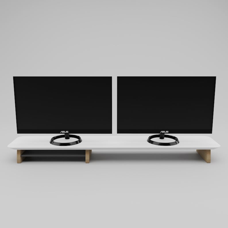 May include: White monitor stand with two black computer monitors on top. The monitors have black bezels and the text "ASUS" on the bottom. The stand has a lower shelf for storage.