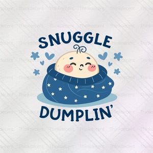 May include: A cartoon illustration featuring a baby wrapped in a blue blanket with white stars. The baby has rosy cheeks and a smiling face. The words "SNUGGLE" and "DUMPLIN'" are written above and below the baby in blue.
