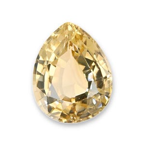May include: A pear-shaped gemstone with a light yellow, golden hue. The stone features a faceted cut that creates multiple triangular and trapezoidal surfaces, reflecting light to produce a bright, clear appearance with sharp, defined edges.