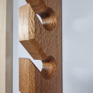 Silky Oak  10 Slot Wall mounted Wooden Cap Holder. Timber Cap Stand. Hat Rack. 10 Hook Cap Display.  Australian made.