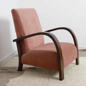 Handmade Armchair with elegant curved wood arms. Cozy, minimalist lounge chair perfect for modern, mid-century, or Scandinavian interiors.