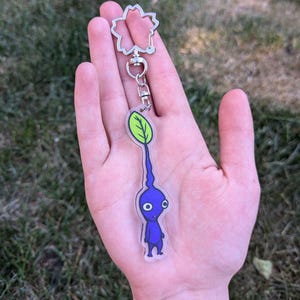 blue pikmin having an existential crisis acrylic keychain, hand drawn video game charm