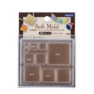 May include: A clear plastic mould with six square compartments for making resin crafts. The mould is labelled "Soft Mold" and "Square Plate". The compartments are labelled with measurements in millimetres: 10mm, 15mm, 20mm, 25mm, and 35mm.