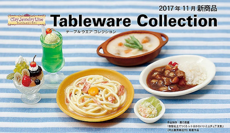 May include: A collection of miniature food items, including a creamy soup, a bowl of pasta with a yolk, a plate of curry and rice, and a dessert with fruit and whipped cream. The food is arranged on a blue and white striped tablecloth. The text "Tableware Collection" is written in black letters on a white background.