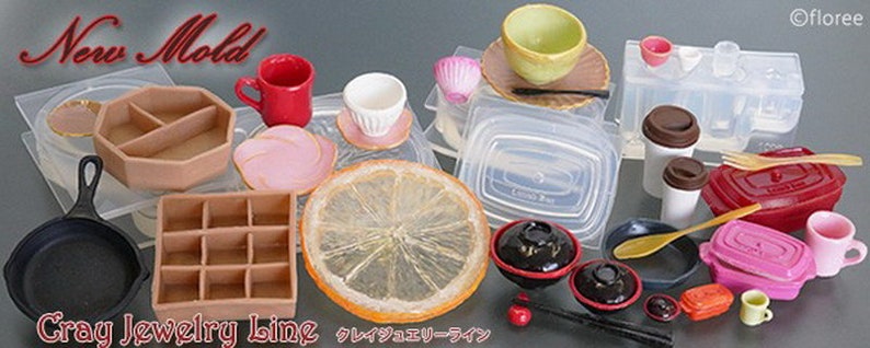 May include: New Mold Cray Jewelry Line silicone molds for crafting. The molds are in various shapes, including a square, a circle, a rectangle, and a heart. The molds are made of clear silicone and are easy to use. The molds are perfect for making jewelry, crafts, and other projects.