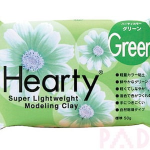 May include: A packet of green Hearty Super Lightweight Modelling Clay. The packet features a green and white flower design and the text "Hearty Super Lightweight Modelling Clay" and "Green".