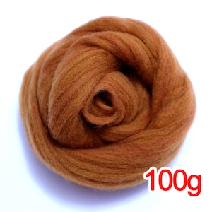May include: A close-up of a 100g bundle of brown wool roving. The wool is soft and fluffy, and it is perfect for felting or spinning.
