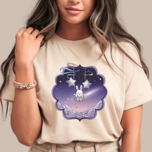Bunny on Star Swing T-Shirt | Kawaii Cosmic Animal Tee | Whimsical Night Sky Graphic | Cute Galaxy Bunny Shirt | Dreamy Aesthetic Top