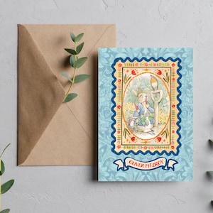 May include: A greeting card featuring a watercolor illustration of a rabbit in a blue jacket, holding a shovel, with a bird perched nearby. The card has a blue floral border and the name "Oliver Fitzroy" on a banner.