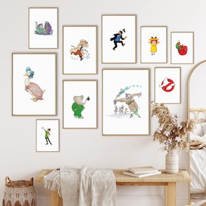 May include: A collection of 10 framed illustrations featuring various characters and scenes. The illustrations include a duck, an elephant, a ghost, a caterpillar, a girl in a yellow dress, a man in a brown coat, and a man in a green suit.