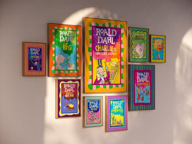 May include: A selection of framed Roald Dahl book covers, such as "The BFG" and "Charlie and the Chocolate Factory." The frames are different sizes and colours, forming a colourful wall arrangement. The book covers display bright illustrations.