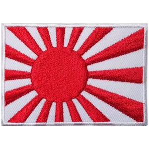 May include: A white embroidered patch featuring a red rising sun design. The sun has 16 rays and a red circle in the centre.