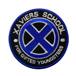 May include: A blue and black embroidered patch with the text "XAVIER'S SCHOOL FOR GIFTED YOUNGSTERS" around a blue X on a black background.