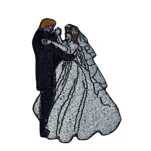 May include: Embroidered patch depicting a bride and groom in a formal wedding pose. The bride is wearing a white gown with a veil and the groom is wearing a black suit. The patch is suitable for sewing or ironing onto fabric.