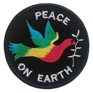 May include: A black circular patch with white embroidery that reads "Peace on Earth". A colourful dove with a branch in its beak is embroidered in the centre of the patch.