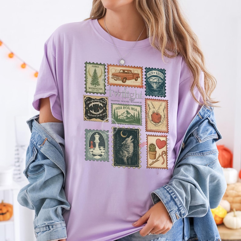 Vintage Twilight stamp shirt featuring retro postage-style graphics inspired by the Twilight saga, including Forks Washington, classic red truck, vampire fangs, wolves, apple, and chess piece. Printed on premium Comfort Colors or Gildan cotton tee for a soft and durable fit. Perfect gift for Twilight fans, book lovers, or movie marathon nights. Cozy fan apparel with aesthetic retro vibes, ideal for everyday casual wear or as a unique fandom collectible shirt.