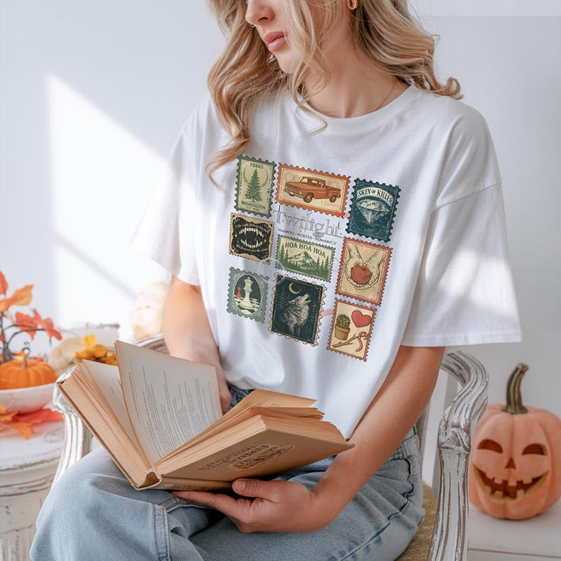 Vintage Twilight stamp shirt featuring retro postage-style graphics inspired by the Twilight saga, including Forks Washington, classic red truck, vampire fangs, wolves, apple, and chess piece. Printed on premium Comfort Colors or Gildan cotton tee for a soft and durable fit. Perfect gift for Twilight fans, book lovers, or movie marathon nights. Cozy fan apparel with aesthetic retro vibes, ideal for everyday casual wear or as a unique fandom collectible shirt.