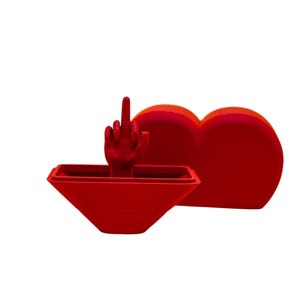 May include: A red heart-shaped box with a red hand giving the middle finger sticking out of the top.