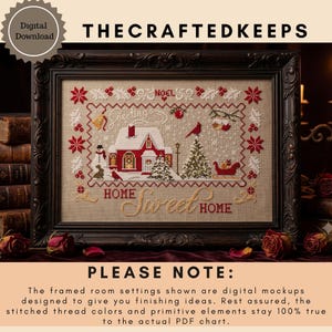 May include: A cross-stitch pattern featuring a red house, a snowman, a cardinal, a sleigh, and a Christmas tree on a beige background. The text reads "Greetings", "NOEL", and "HOME Sweet HOME" in red and gold. It is displayed in a dark ornate frame.