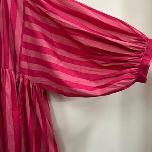 ​Eco-friendly handcrafted striped dress for sustainable style.