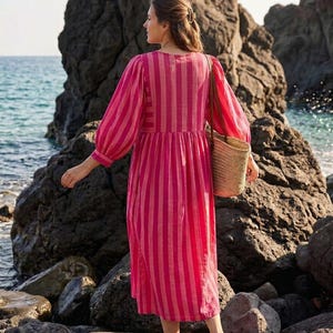 ​Pink and red striped holiday outfit for beach vacations.