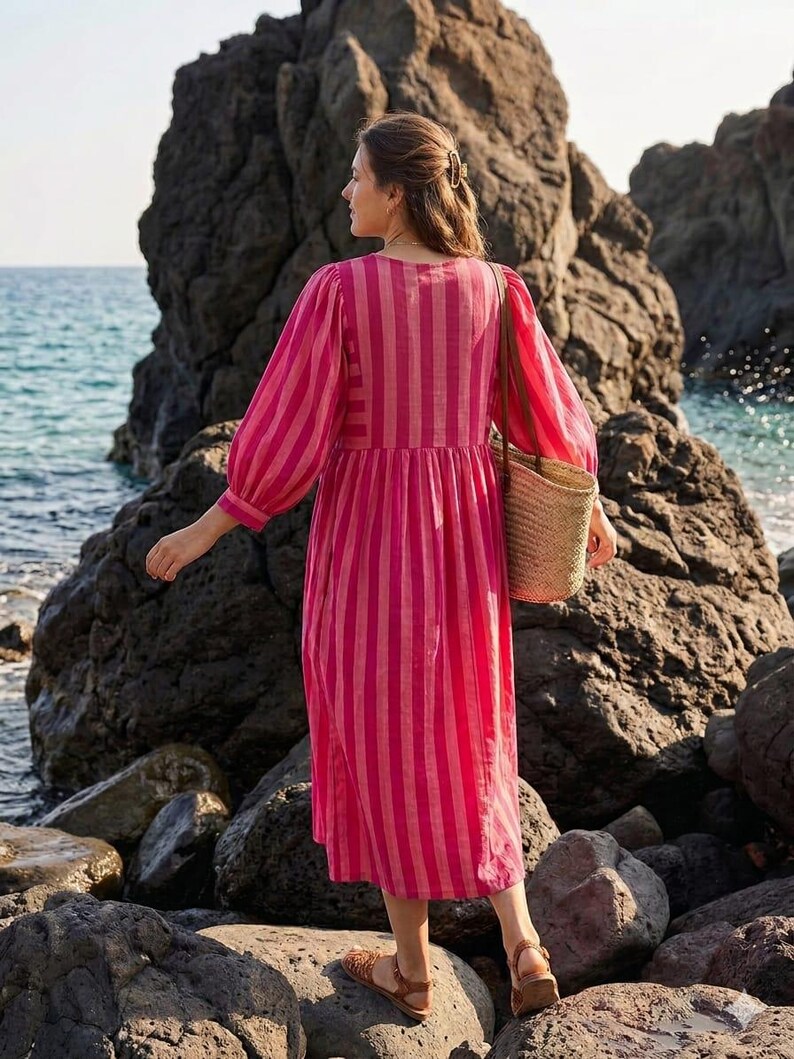 ​Pink and red striped holiday outfit for beach vacations.