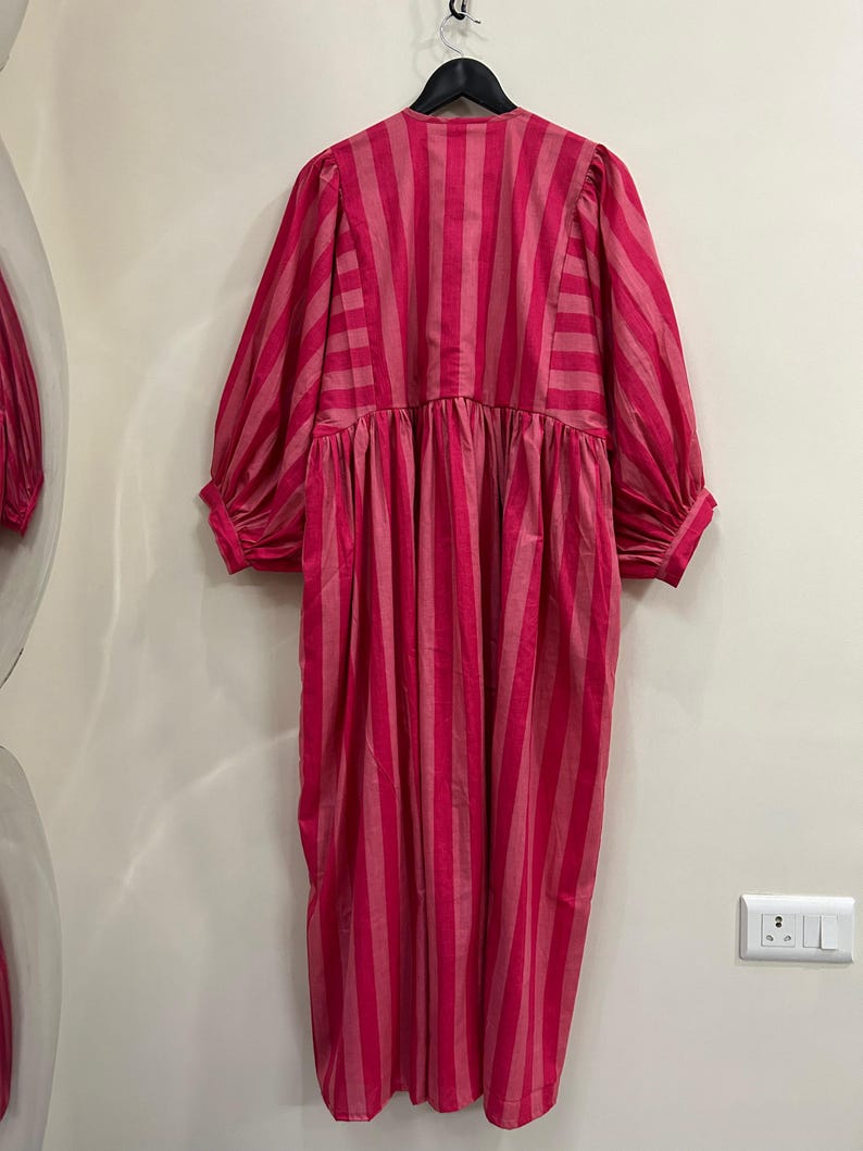 ​Detailed back view of pink striped cotton midi dress.