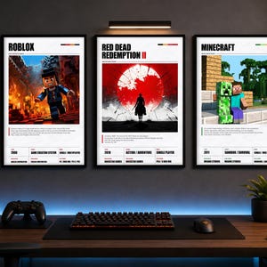 Op de afbeelding: Drie rechthoekige wandposters in zwarte lijsten met videospelthema's. De linker poster toont Roblox, de middelste poster toont Red Dead Redemption II met een grote rode zon, en de rechter poster toont Minecraft met een creeper en een personage.