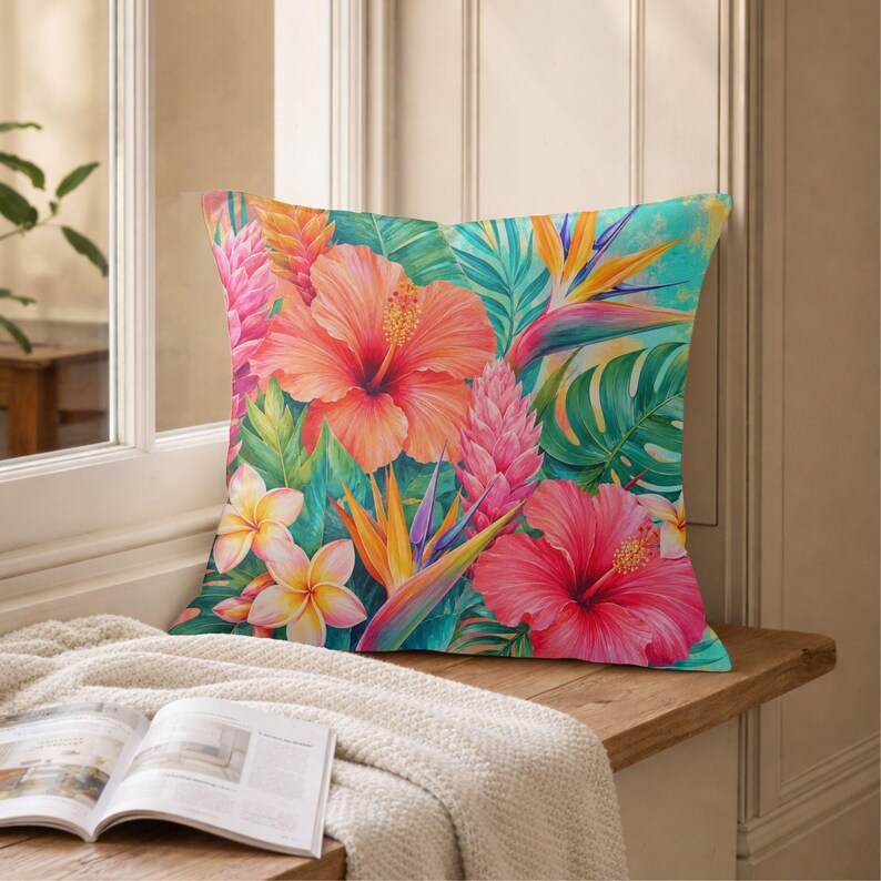 May include: A square throw pillow featuring a vibrant tropical print with large pink and orange hibiscus flowers, yellow plumeria blossoms, bird of paradise flowers, and various green palm leaves set against a bright turquoise background.
