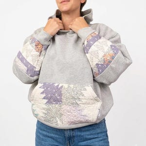 Op maat gemaakte, gewatteerde hoodie van gerecycled materiaal | Vintage patchwork sweatshirt met stervormig zakje