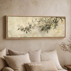 May include: A rectangular framed canvas art print featuring a botanical illustration. The artwork depicts a branch with green and grey leaves and small berries against a soft, beige background. The frame is a light wood colour.