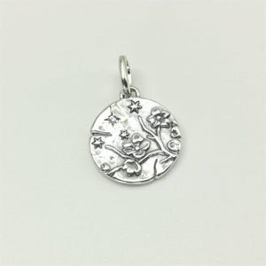 May include: A set of three ceramic mugs with a speckled, matte finish. The mugs are in shades of cream, light gray, and dark gray. Each mug has a simple, minimalist design, perfect for coffee or tea.