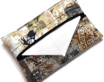 May include: A beige and brown fabric tissue box cover with a black trim. The cover features a vintage Parisian-themed print with images of the Eiffel Tower, a hot air balloon, and the words "Goutte d'Eau".
