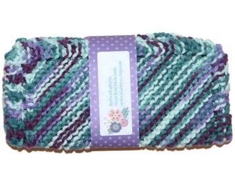 May include: A hand-knitted dishcloth in a green, purple and white colour scheme. The dishcloth is packaged with a purple label that reads "SydneyKadreyen Hand Knit Dishcloths sydneykadreyen.etsy.com".