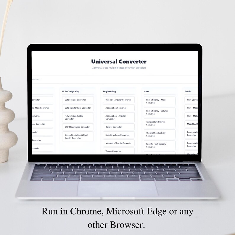 May include: A silver laptop displays a "Universal Converter" website, offering conversions across multiple categories. The screen shows options for IT & Computing, Engineering, Heat, and Fluids. The text at the bottom reads: "Run in Chrome, Microsoft Edge or any other Browser."