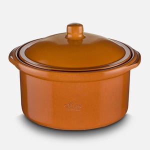 May include: A terracotta casserole dish with a lid. The dish has a round shape and two handles. The lid has a knob on top. The dish is made of ceramic and has a brown glaze.