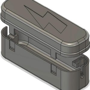 May include: A grey, rectangular case with a hinged lid. The lid features a lightning bolt design. The case is open, revealing the interior. The case is made of a solid material.