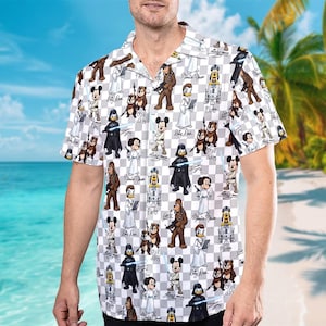 May include: White button-down shirt with a gray and white checkered pattern. The shirt features cartoon characters from Star Wars and Disney, including Mickey Mouse, Darth Vader, and Chewbacca. The shirt has short sleeves and a relaxed fit.