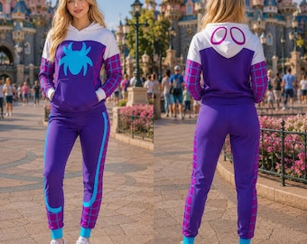 May include: A purple and white hooded sweatshirt and matching sweatpants set featuring a blue spider graphic on the chest, a grid pattern on the sleeves and legs, and a hood with two purple oval shapes. The outfit includes white sneakers.