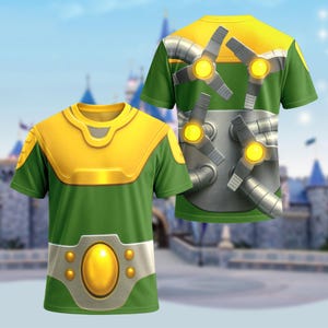 May include: Green and yellow short-sleeve t-shirt with a futuristic design. The front features a yellow chest plate and a silver belt with a large yellow oval. The back has a design of silver tubes and propellers with yellow lights.