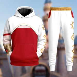 May include: A white and red hoodie and matching sweatpants set. The hoodie has a red front with a white upper section and a black hood. Gold accents and a large pocket are visible. The sweatpants are white with gold decorative patterns.