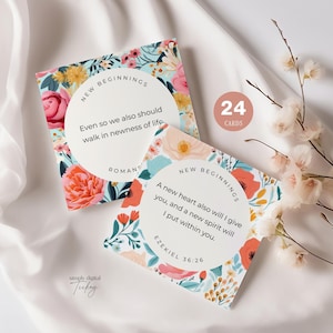 May include: Two floral-patterned cards with the text "New Beginnings" and inspirational quotes. The cards are surrounded by a white background with a sprig of flowers and a circle that says "24 Cards".