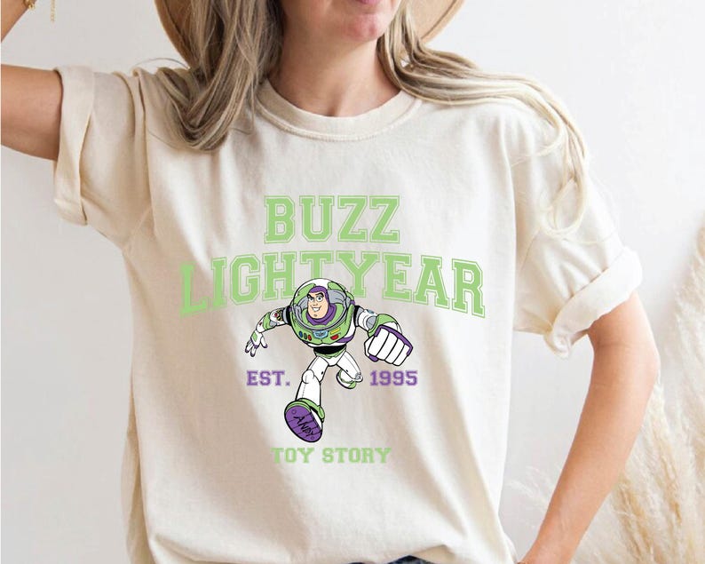 a woman wearing a buzz lightyear t - shirt