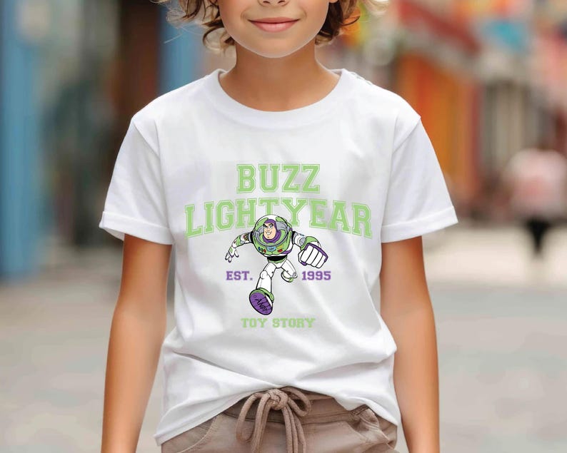 a young boy wearing a buzz lightyear t - shirt