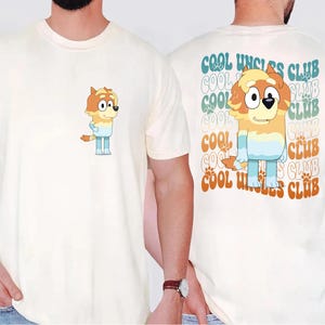 May include: A white ceramic mug with a black handle and the text "But First, Coffee" in a bold, black font. The mug is set against a blurred background, suggesting a cozy setting. The mug appears to be approximately 4 inches tall.